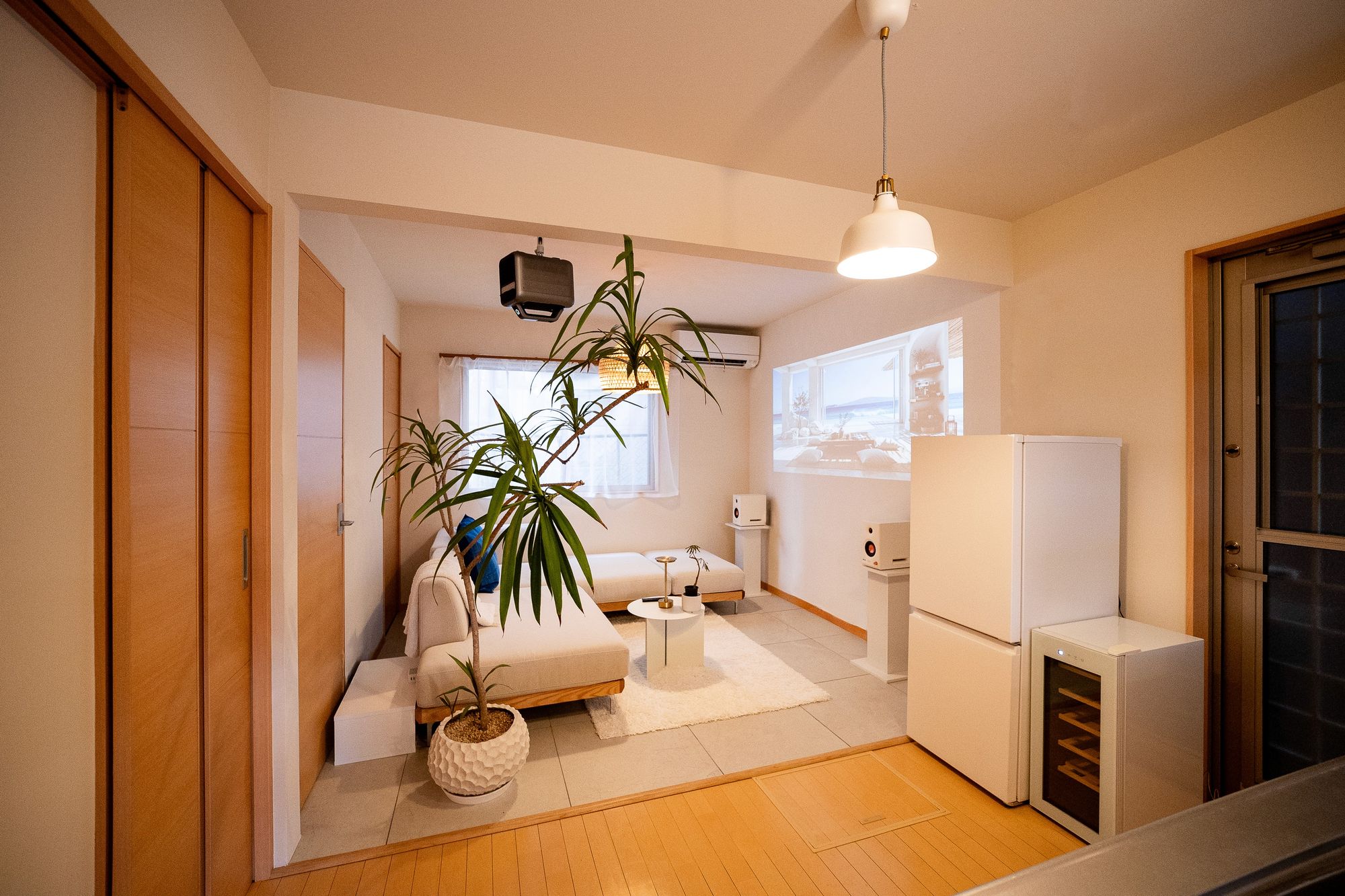 Bright living room with a potted palm