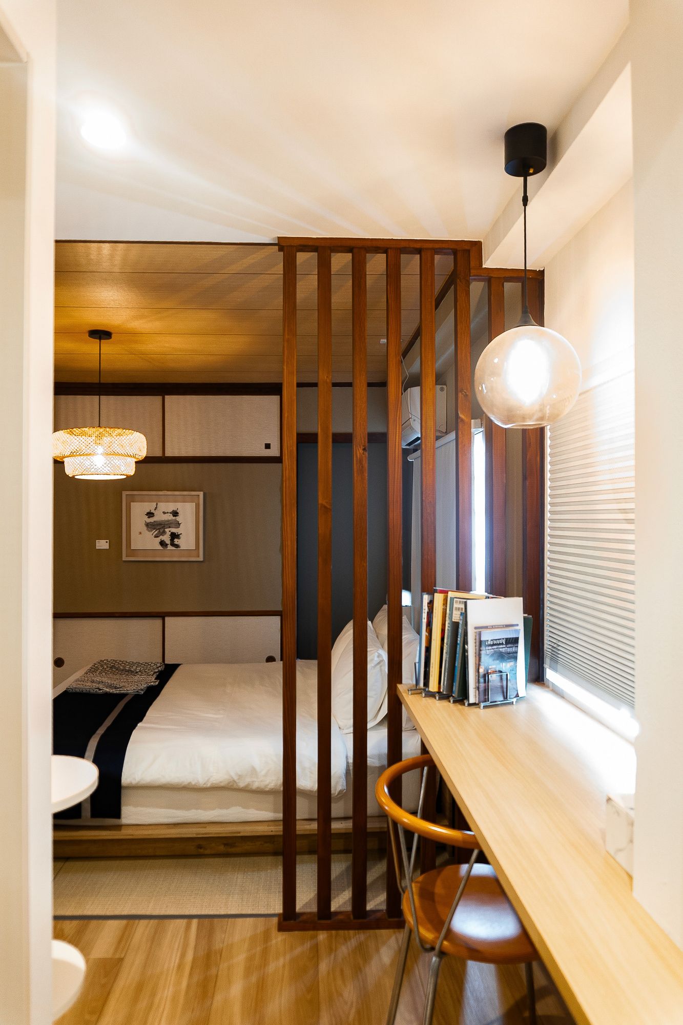 Bright white room with a wooden bench counter at the window