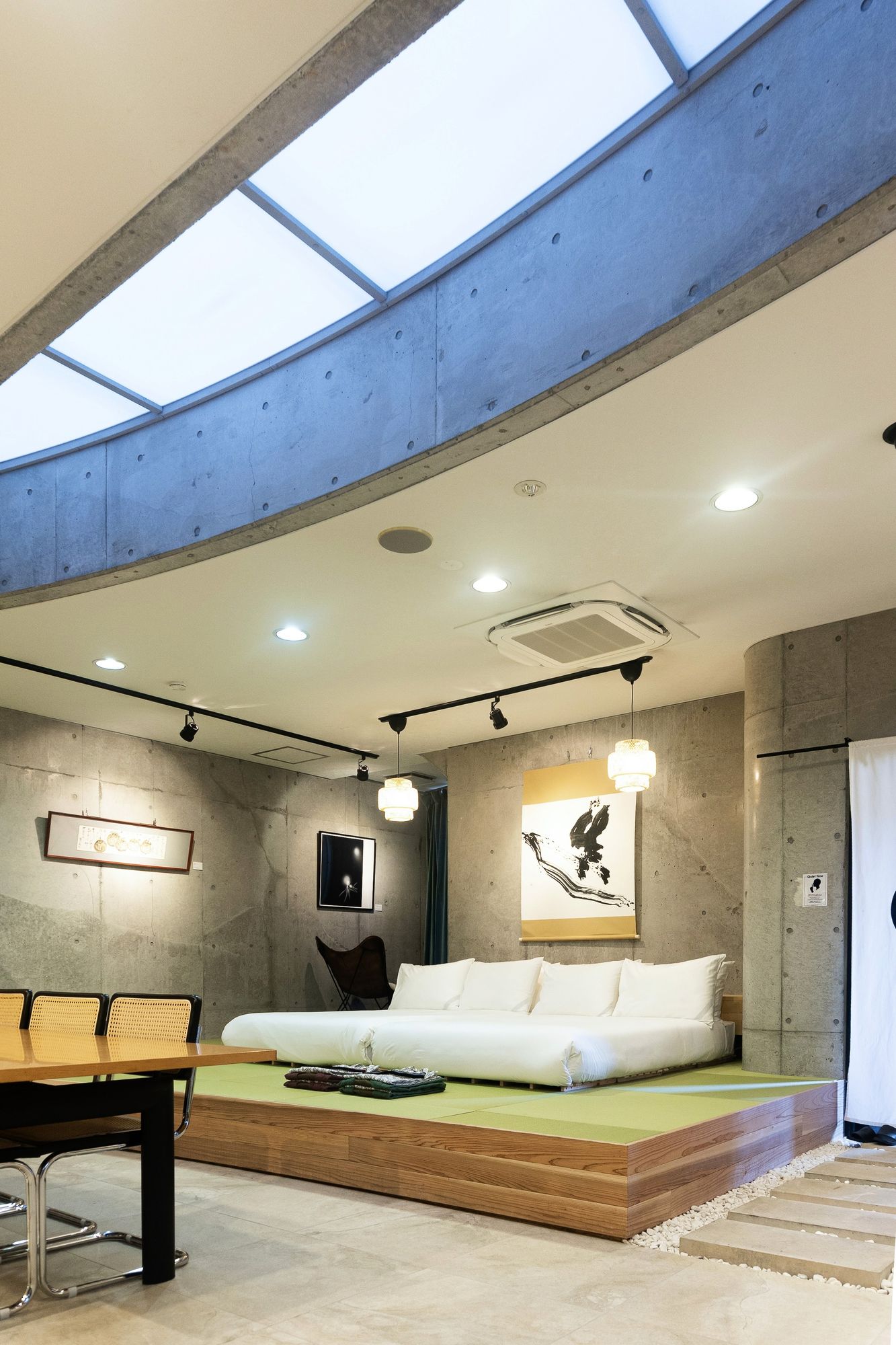 Concrete suite with oval skylight